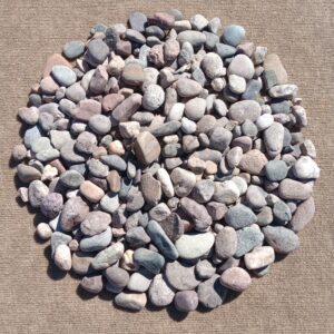 Circle of small, assorted colored pebbles.